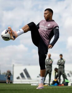 Kylian Mbappé tests an all-white On prototype boot during Real Madrid training, months before the brand's first football silo launches in 2027.