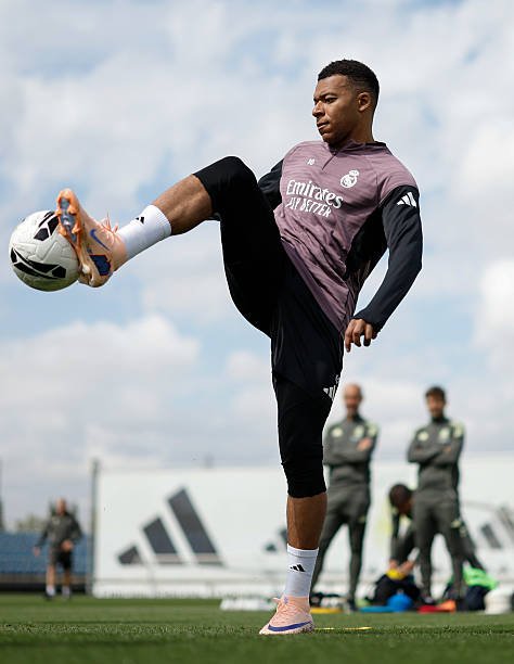Kylian Mbappé tests an all-white On prototype boot during Real Madrid training, months before the brand's first football silo launches in 2027.